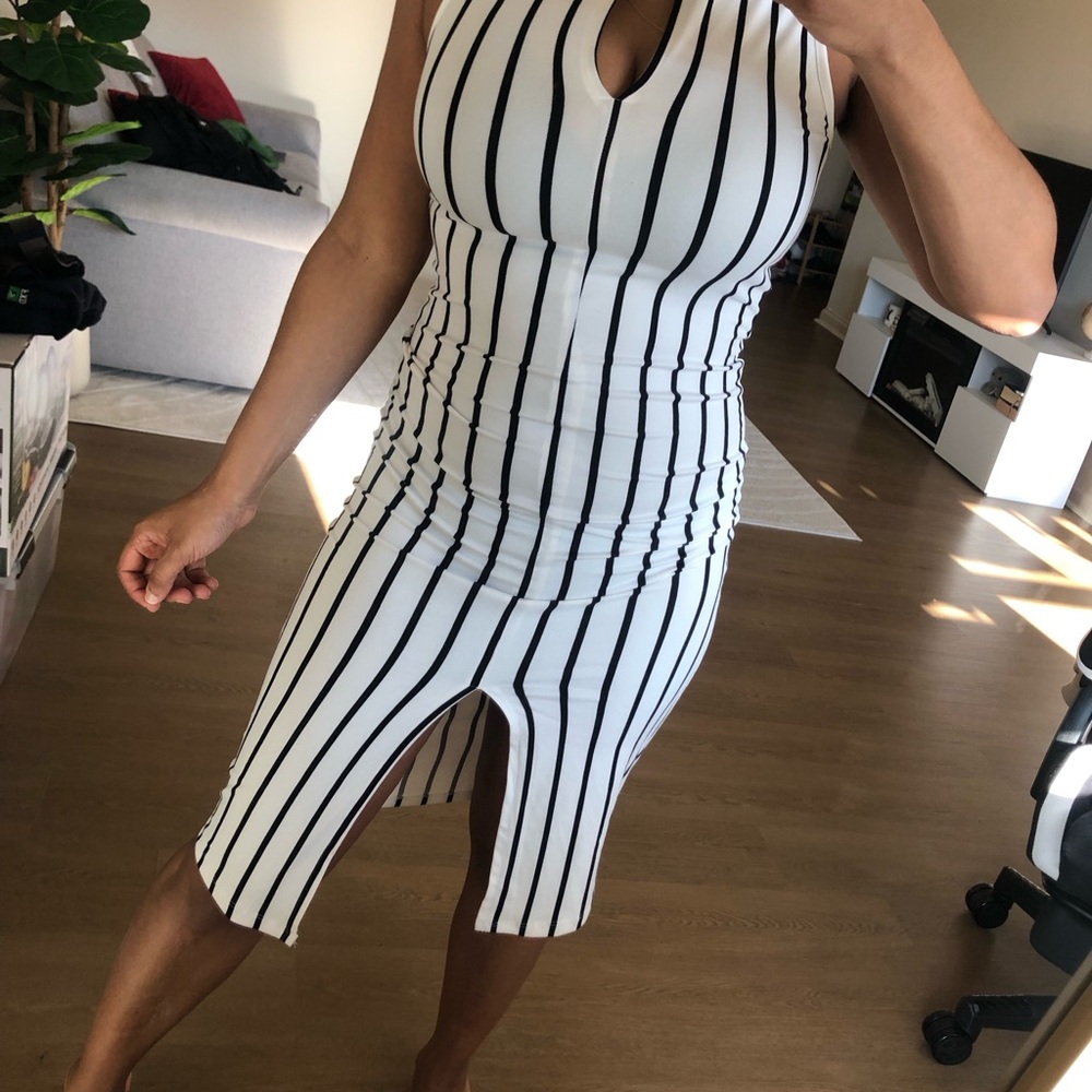 Sleeveless White Dress with Black Vertical Stripes and Front Slit